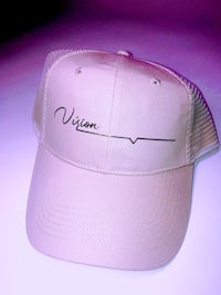 a trucker hat with the word vision on it