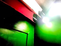 a green door with a red light on it